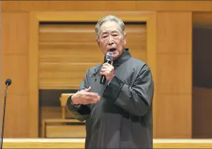  ??  ?? Shi Peng, a Changsha-based expert on ancient Chinese poetry, recites a poem at the Beijing concert.