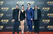  ?? PROVIDED TO CHINA DAILY ?? From left to right: Director Travis Knight, actress Hailee Steinfeld, actor John Cena and producer Lorenzo di Bonaventur­a attend a news conference to promote Bumblebee in Beijing on Dec 14.