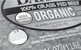  ?? [AP PHOTO] ?? A “USDA Organic” label is printed on the label of a pound of ground beef. The USDA Organic label generally signifies a product is made without synthetic pesticides and fertilizer­s, and that animals are raised according to certain standards. But...