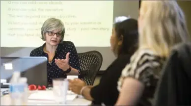  ?? MATHEW MCCARTHY, RECORD STAFF ?? Almira Hodzic, a community health worker at the centre, teaches a workshop on the importance of being your own proponent.