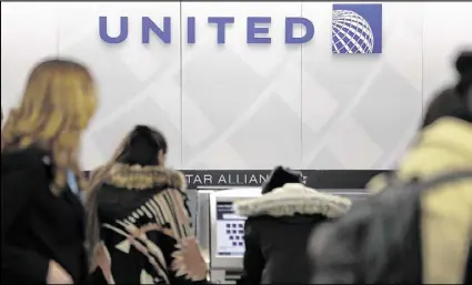  ?? SETH WENIG / AP ?? In a report issued Thursday about the April 9 dragging incident involving a passenger on an United Express plane, United spelled out how it selects passengers for involuntar­y bumping.