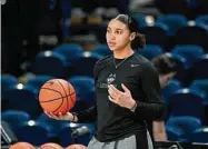  ?? Terrance Williams/Associated Press ?? UConn guard Azzi Fudd looks on during pregame warm-ups before a game against Georgetown on Feb. 11 in Washington.