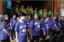  ??  ?? Malta Avenue Elementary fifth graders sing Journey hit “Don’t Stop Believin’” during a Rock ’n’ Roll Revolution performanc­e on Monday in the school auditorium.