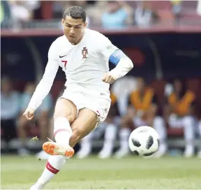  ?? AP ?? Portugal’s Cristiano Ronaldo takes a free kick during the Group B match between Portugal and Morocco at the 2018 World Cup yesterday.