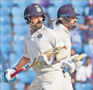  ??  ?? Cheteshwar Pujara (left) and Murali Vijay put on 209 runs for the second wicket against Sri Lanka in Nagpur on Saturday.