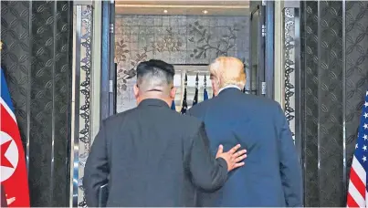 ?? Picture: PA. ?? The signing ceremony between US president Donald Trump and leader of North Korea, Kim Jong-un, at Capella, Singapore.