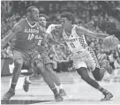  ?? WADE PAYNE / AP ?? Kentucky guard De'Aaron Fox drives against Alabama forward Jimmie Taylor during the semifinals of the Southeaste­rn Conference tournament Saturday in Nashville, Tenn. Fox scored a career-high 28 points in Kentucky’s 79-74 victory.