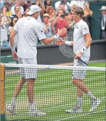  ??  ?? Kevin Anderson and John Isner shake hands after their epic semi-final on Friday