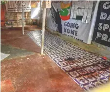  ?? Photo — AFP ?? Blood stains on the floor are pictured in the office of Ullah, who was shot dead by gunmen in late September, at Kutupalong refugee camp in Ukhia.