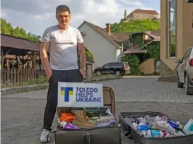  ?? ?? Misha Ostapenko in front of suitcases full of aid from Toledo Helps Ukraine on May 12.