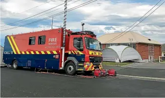  ??  ?? The scene at Lock St in St Clair, Dunedin, after a homicide investigat­ion was launched.