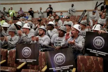  ??  ?? This May 18 file photo shows laborers union members cheering during a meeting of the Las Vegas Stadium Authority board, in Las Vegas. As the Supreme Court prepares to hear a challenge to the federal ban on sports betting, U.S. sports leagues are...