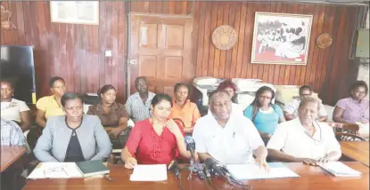  ??  ?? President of the Guyana Public Service Union, Patrick Yarde (third from left) tells reporters that the persistent ill-treatment of sweeper/cleaners is the government’s “badge of shame.”