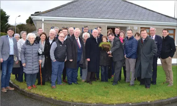  ??  ?? Cathaoirle­ach of Sligo County Council Martin Baker turns sod at Cuan Iosa.Ballymote where an extension of eight new houses will be built.