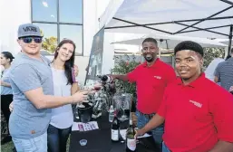  ??  ?? The Perdeberg team was happy to share its Pinotages with the crowd that attended the festival.