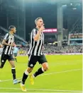  ?? | EPA ?? NEWCASTLE defender Fabian Schar, front, celebrates with his teammates after scoring one of his two goals against Aston Villa.