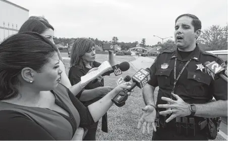  ?? Jason Fochtman / Staff photograph­er ?? Montgomery County Sheriff ’s Office Lt. Scott Spencer provides an update on the barefoot woman seen on surveillan­ce video.