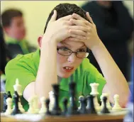  ??  ?? Mark McHugh from Manorhamil­ton, Co Leitrim, works out his next move during the U13 Chess competitio­n