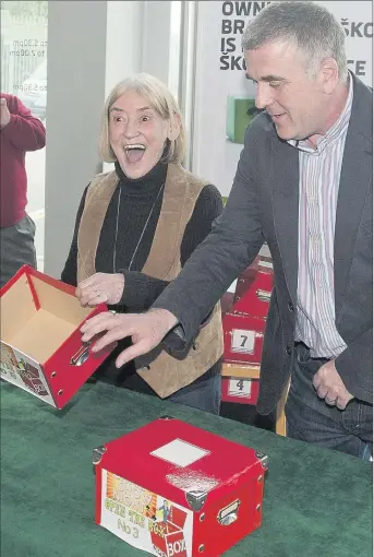  ??  ?? The moment of truth as winner Phil Watson picks the box which holds the key to a new Skoda Citigo.