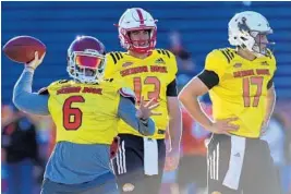  ?? BUTCH DILL/AP ?? Project first-round picks quarterbac­ks Baker Mayfield (6) and Josh Allen (17) have brought additional attention to the North Squad at the Senior Bowl.