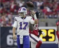  ?? MICHAEL WYKE - THE ASSOCIATED PRESS ?? Buffalo Bills quarterbac­k Josh Allen (17) tosses the ball back after he was sacked during the first half of an NFL football game against the Houston Texans, Sunday, Oct. 14, 2018, in Houston.