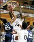  ?? THE ASSOCIATED PRESS FILE PHOTO ?? Central Florida’s Tacko Fall (24) dunks over the defense of Villanova’s Darryl Reynolds.