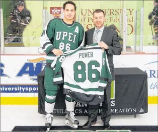  ?? FILE PHOTO/UPEI ?? Marcus Power, shown earlier this year with UPEI Panthers head coach Forbes Macpherson at a ceremony to honour graduating players, averaged nearly a point per game (107 points in 110 GP) over four seasons with the Panthers.