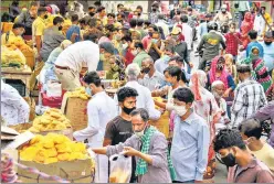  ?? PTI ?? People buy sweets and new clothes on the eve of Eid-ul-fitr at Jama Masjid market, in Sadar Bazar during Covid-19 lockdown in Gurugram on Thursday.