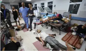  ?? Photograph: Dawood Nemer/AFP/Getty Images ?? Wounded Palestinia­ns receive treatment at al-Shifa hospital in Gaza City amid ongoing battles between Israel and Hamas.