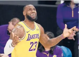  ?? MARCIOJOSE SANCHEZ/AP ?? LeBron James and his Lakers teammates received their championsh­ip rings Tuesday night, but then fell to the Clippers 116-109 in an opener for both teams.