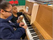  ?? COURTESY OF LORAIN CITY SCHOOLS ?? Stevan Dohanos Elementary School fourth-grader Ruben Rojas is a future pianist in “training.” Ruben has taken to piano this year, mentoring his peers and motivating them to keep trying.