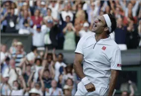  ?? ADRIAN DENNIS - THE ASSOCIATED PRESS ?? Switzerlan­d’s Roger Federer celebrates after beating Spain’s Rafael Nadal in a Men’s singles semifinal match on day eleven of the Wimbledon Tennis Championsh­ips in London, Friday, July 12, 2019.