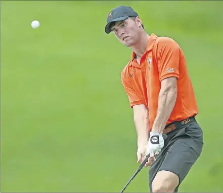  ??  ?? Austin Eckroat chips during the final round of the 2018 NCAA Division I Men's Golf Championsh­ips at Karsten Creek Golf Club in Stillwater. Eckroat of Edmond is playing as an amateur in the U.S. Open which begins Thursday in Pebble Beach, California. [BRYAN TERRY/THE OKLAHOMAN]