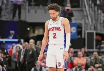  ?? Gregory Shamus/getty Images ?? The Pistons’ Cade Cunningham looks on in the fourth quarter on the way to a 119-111 loss to the Jazz on Thursday in Detroit, the team’s 25th straight.