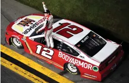  ?? (Logan Riely/Getty Images) ?? Ryan Blaney, driver of the #12 BodyArmor Ford, celebrates after winning the Cup Series Coke Zero Sugar 400 at Daytona Internatio­nal Speedway Saturday night.