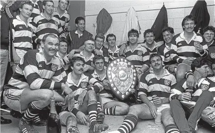  ??  ?? Andy Haden, kneeling left, with his Auckland team-mates after winning the Ranfurly Shield off Canterbury in 1985.