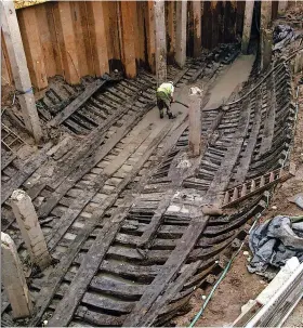  ?? © NEWPORT MUSEUMS AND HERITAGE SERVICE ?? The hull in place in 2002. The building work had sunk concrete supports and a cofferdam which damaged the remains and made it impossible to lift the hull out in one piece