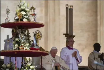  ?? GREGORIO BORGIA — THE ASSOCIATED PRESS ?? Pope Francis sits by the relics of 10 new saints on the altar in St. Peter’s Square at The Vatican on Sunday.