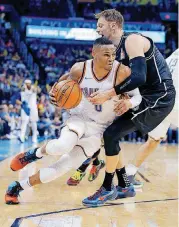  ?? THE OKLAHOMAN] [PHOTO BY SARAH PHIPPS, ?? Oklahoma City’s Russell Westbrook, left, tries to get by Melbourne’s David Anderson during Sunday’s preseason game at Chesapeake Energy Arena.