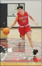  ??  ?? Russellvil­le sophomore Austen Tilley moves the ball across the court during a recent practice.