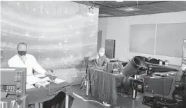  ?? COURTESY FOX SPORTS FLORIDA ?? Fox Sports Florida’s Marlins broadcaste­rs Todd Hollandswo­rth (left) and Paul Severino (right) call a Marlins road exhibition game in Atlanta from their remote “den” at Marlins Park ahead of the shortened 2020 regular season.