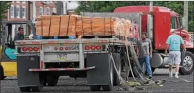  ?? JOHN STRICKLER — DIGITAL FIRST MEDIA ?? The first tractor trailer carrying close to 42,00 pounds of bricks arrived at the Colebrookd­ale Railroad yard in Boyertown on Thursday. The bricks dating back to the early 1900s will be used at the site. There will more tractor trailer deliveries of...