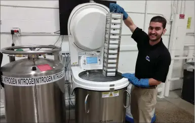  ?? PHOTO COURTESY OF DAVID MCCALLUM ?? David McCallum, 30, of Sterling Heights, stands beside a liquid nitrogen tank. As a CAD designer working in cryogenics, McCallum has been awarded Oakland University’s first Frontline Workers Scholarshi­p.