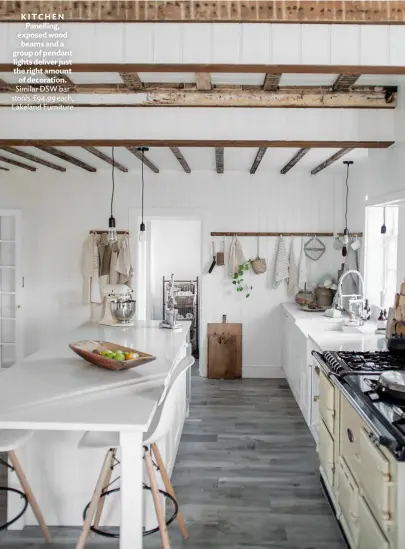  ??  ?? KITCHEN Panelling, exposed wood beams and a group of pendant lights deliver just the right amount of decoration. Similar DSW bar stools, £94.99 each, Lakeland Furniture