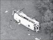  ?? Associated Press ?? A BUS carrying 53 farmworker­s collided with a truck in Marion County, Fla., northwest of Orlando.