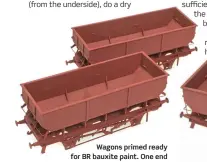  ??  ?? Wagons primed ready for BR bauxite paint. One end vertical hand rail had fallen off at this stage and was reinstated later in the project. Only scant amounts of adhesive were used during assembly for as neat a
finish as possible, but sometimes it’s not enough to hold metal parts!
