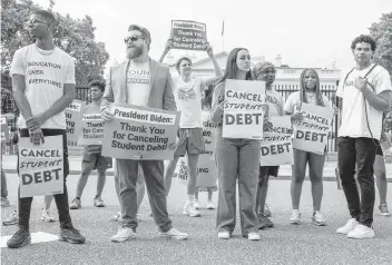  ?? CRAIG HUDSON For The Washington Post ?? Activists rally at the White House, a day after President Joe Biden announced a plan to cancel up to $10,000 in federal student debt for those making less than $125,000 a year. Pell Grant recipients could get an extra break.