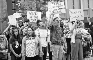  ?? MICHAEL DEMOCKER/THE (NEW ORLEANS) TIMES-PICAYUNE ?? People protest the policy of separating families at the border outside the Ernest N. Morial Convention Center in New Orleans, where Attorney General Jeff Sessions spoke to the National Sheriffs’ Associatio­n on Monday.