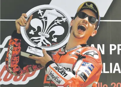  ?? Picture: AFP ?? SWEET VICTORY. Ducati’s Jorge Lorenzo celebrates on the podium after winning the Italian MotoGP at Mugello yesterday.