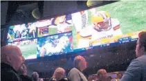  ?? WAYNE PARRY/AP FILE ?? Football fans watch the action in the sports betting lounge at the Ocean Resort Casino in Atlantic City, New Jersey.